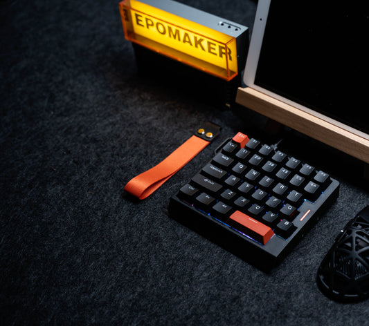 Top view of the black EPOMAKER HE30 one-handed Hall Effect gaming keyboard with orange accent keys