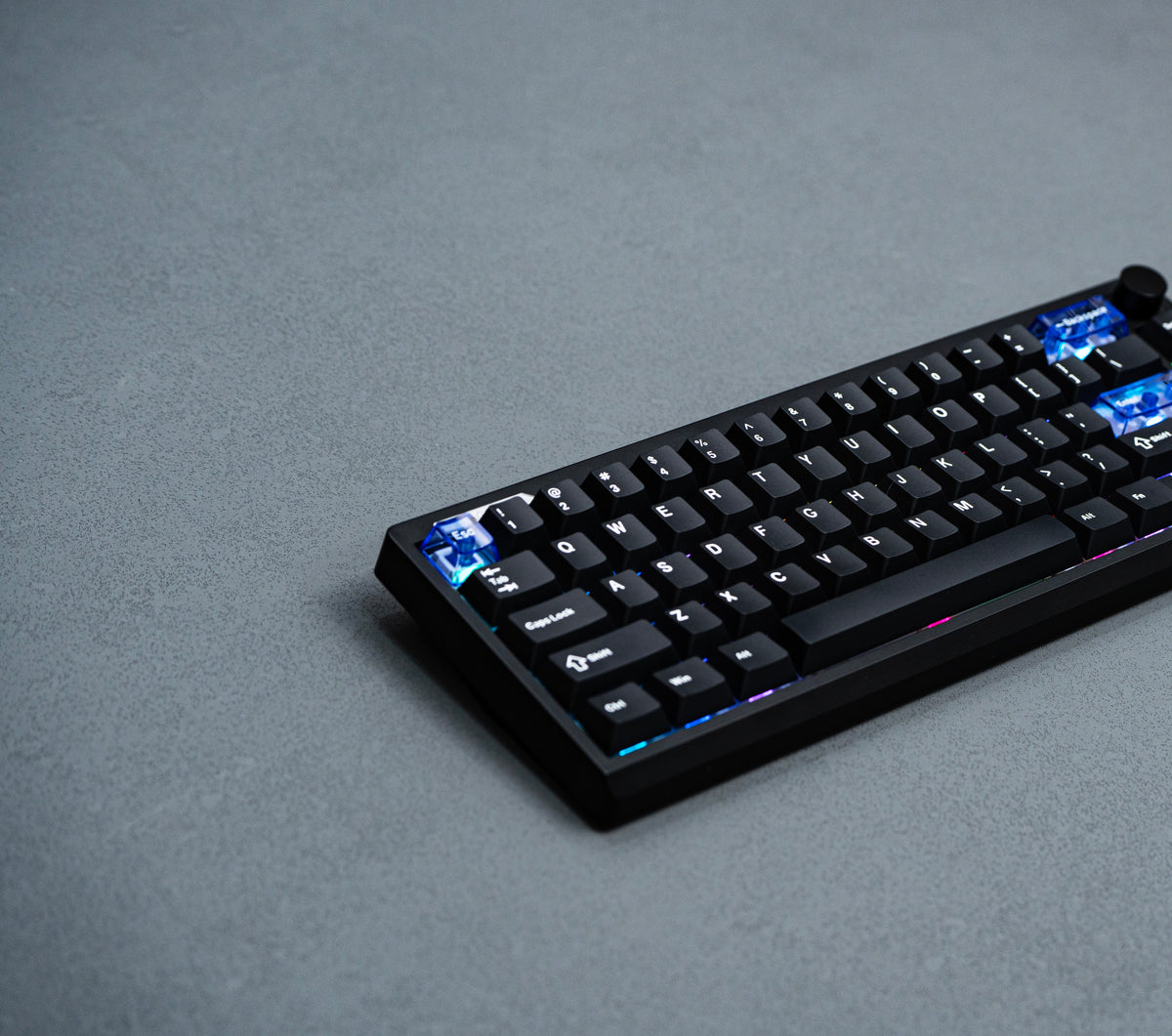 Low angled view of the black EPOMAKER Magcore65 Lite 65% inductive analogue gaming keyboard with RGB lighting