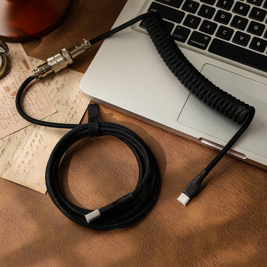 Black EPOMAKER MIX Cable V2 arranged in a coiled desktop setup
