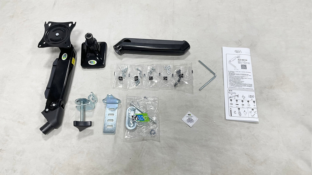 KALOC DS110 arm components, mounting hardware, screws, hex keys and instruction leaflet laid out.