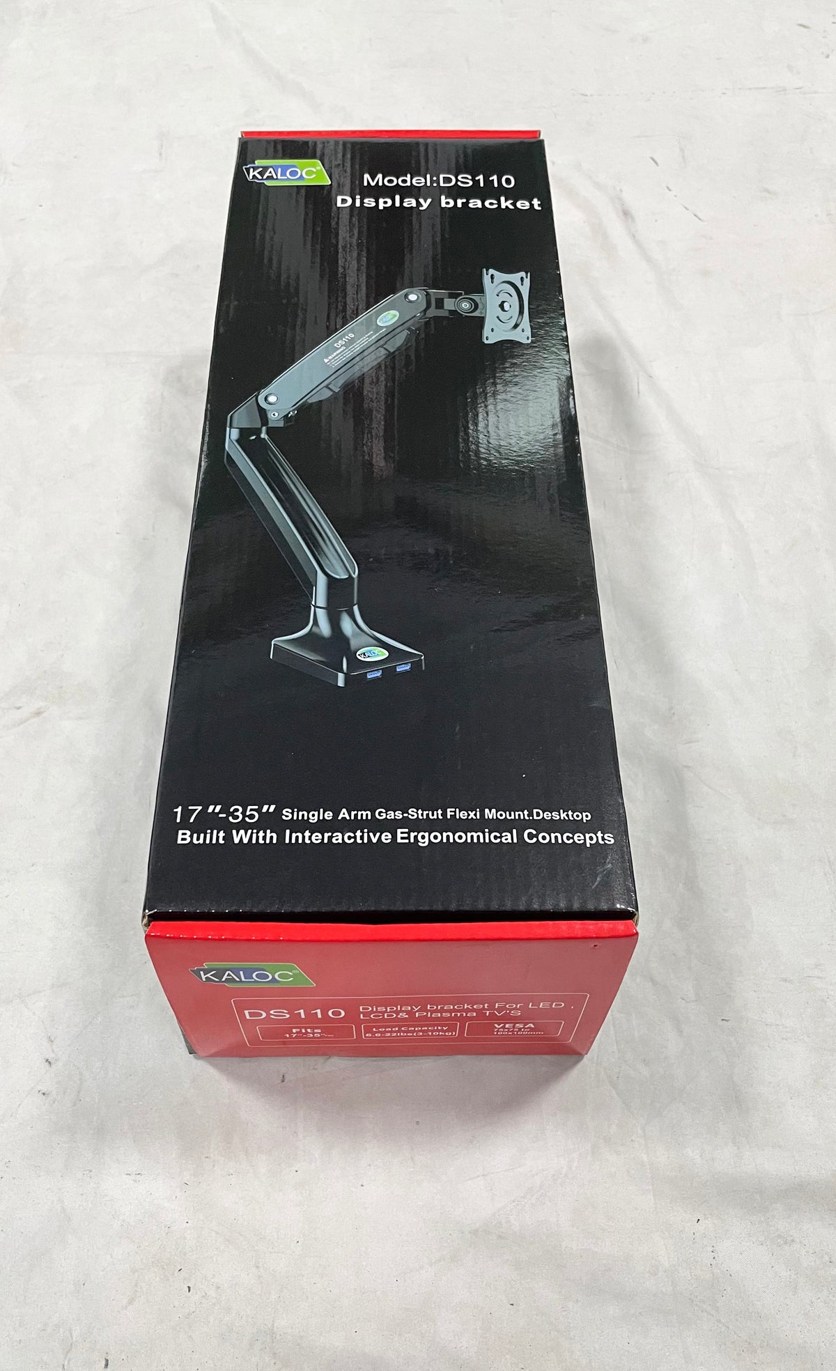 Closed KALOC DS110 retail box with a monitor arm illustration and model label.
